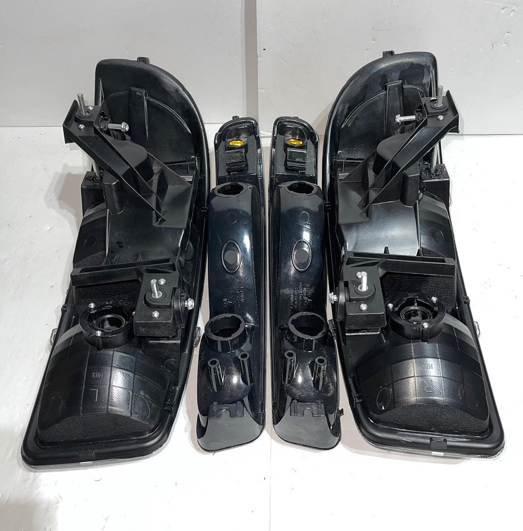 . GMC Sierra / Yukon Black Housing Headlights for 1999 to 2006