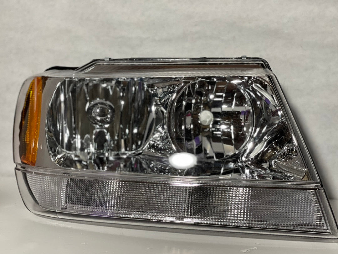 99-04 Jeep Grand Cherokee BLACK HOUSING WITH CLEAR AND AMBER HEADLIGHTS (New)