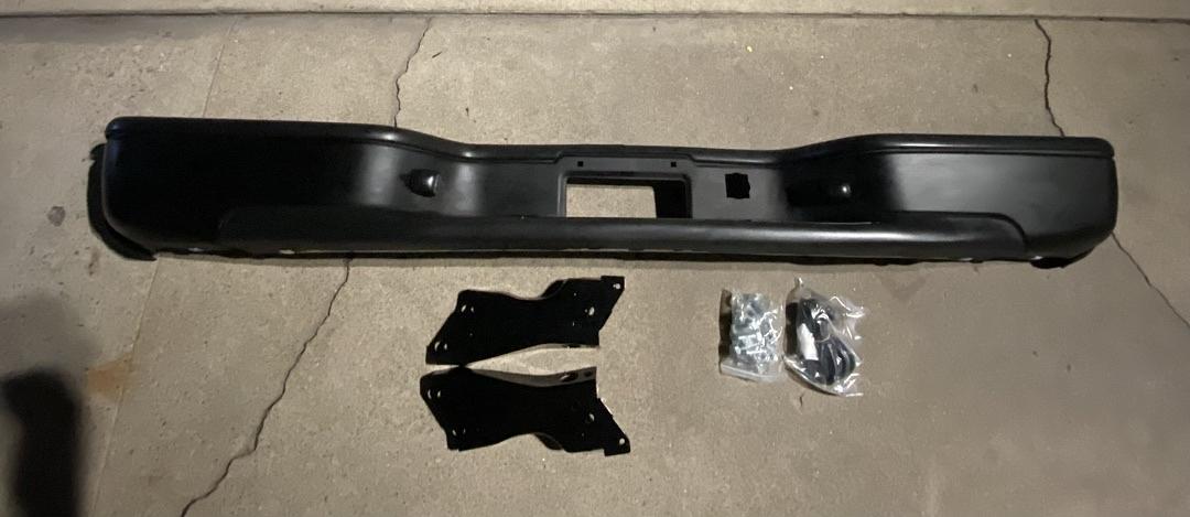 99-06 Chevy Silverado / Gmc Sierra rear black bumper with brackets and complete hardware new new
