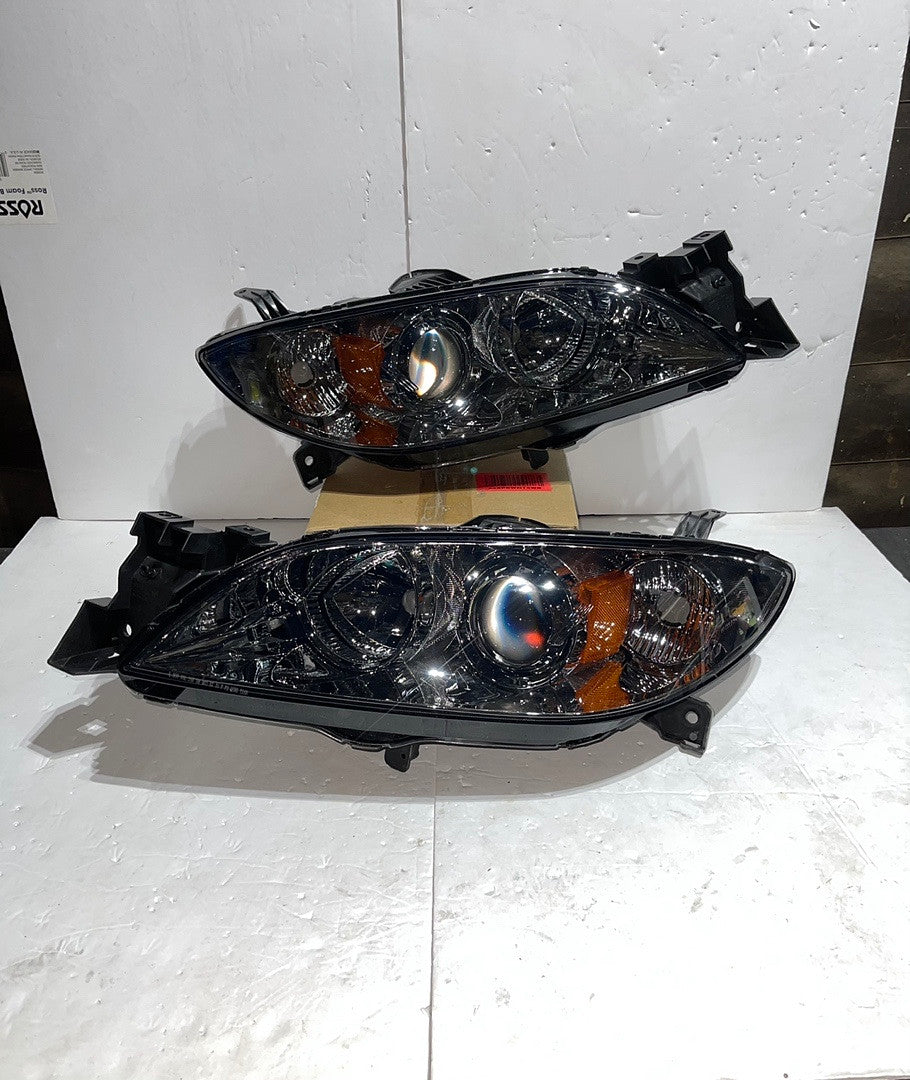 04-09 Mazda 3 4DR Clear HOUSING AND Smoked amber PROJECTOR HEADLIGHTS