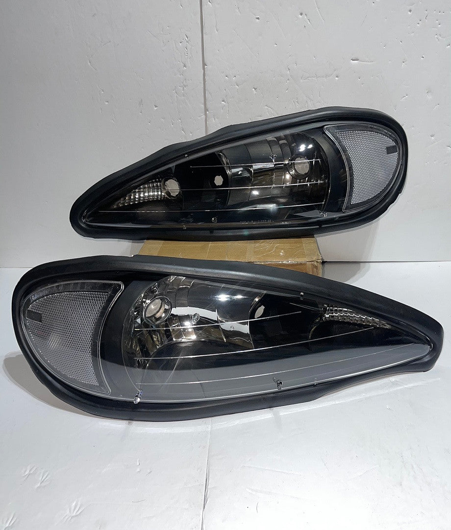 Pontiac Grand Am Black Housing Headlights Clear Reflectors for 1999 to 2004