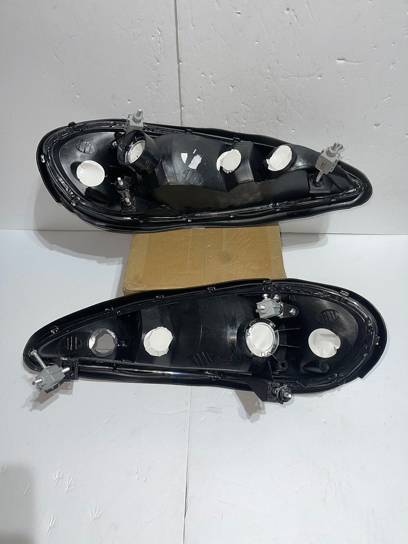 Pontiac Grand Am Black Housing Headlights Clear Reflectors for 1999 to 2004