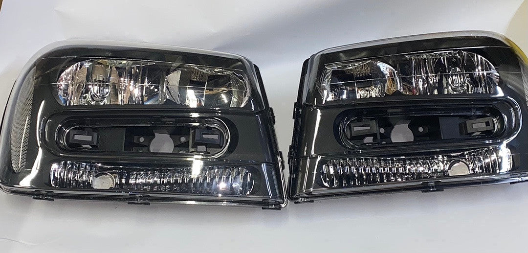 02-09 chevy trailblazer black housing headlights