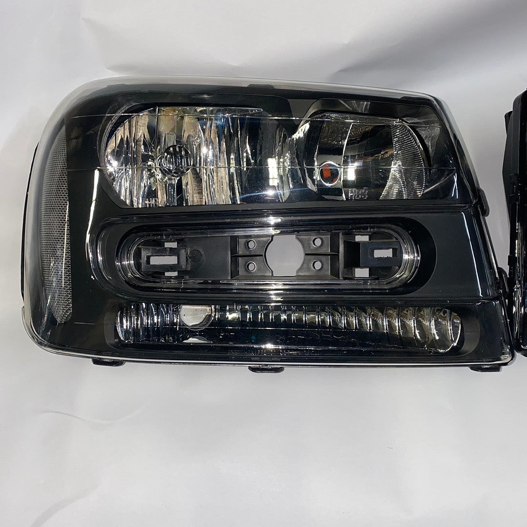 02-09 chevy trailblazer black housing headlights