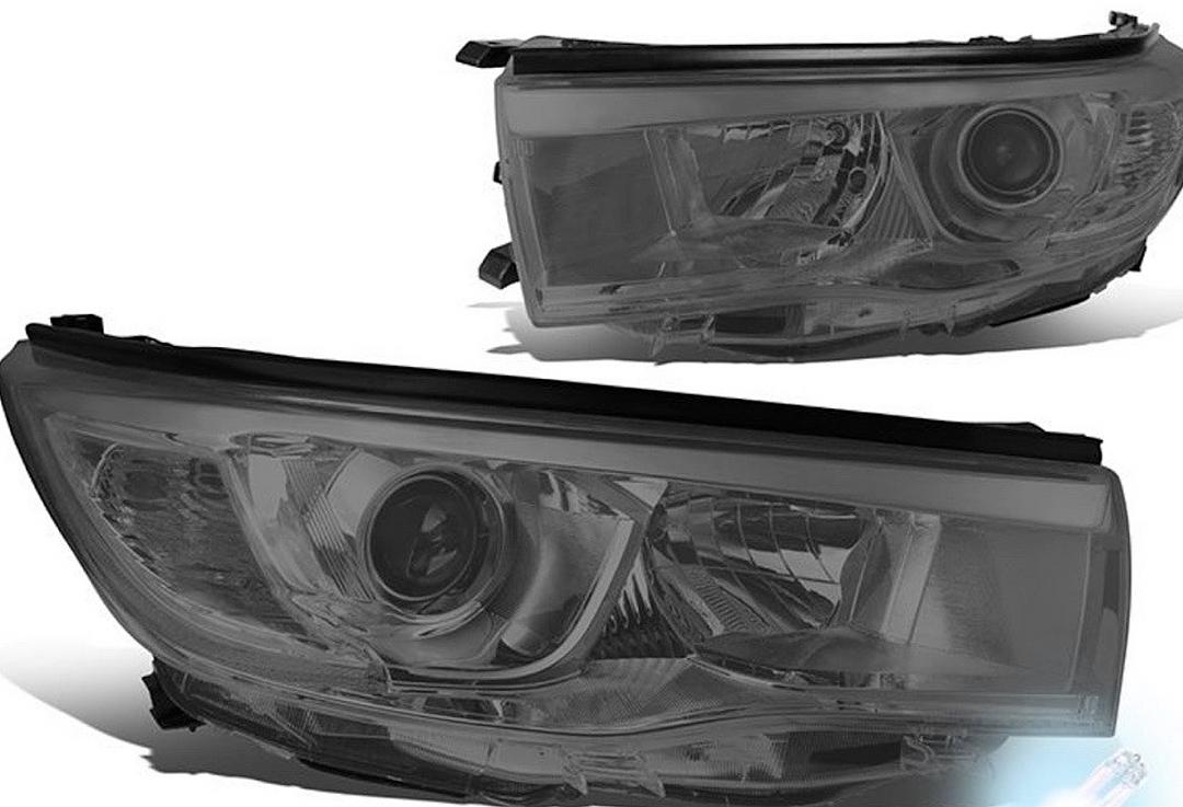 14-16 Toyota Highlander black housing and clear with amber projector headlights